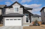 Property Photo: 912 PRAIRIE SPRINGS DR SW in AIRDRIE